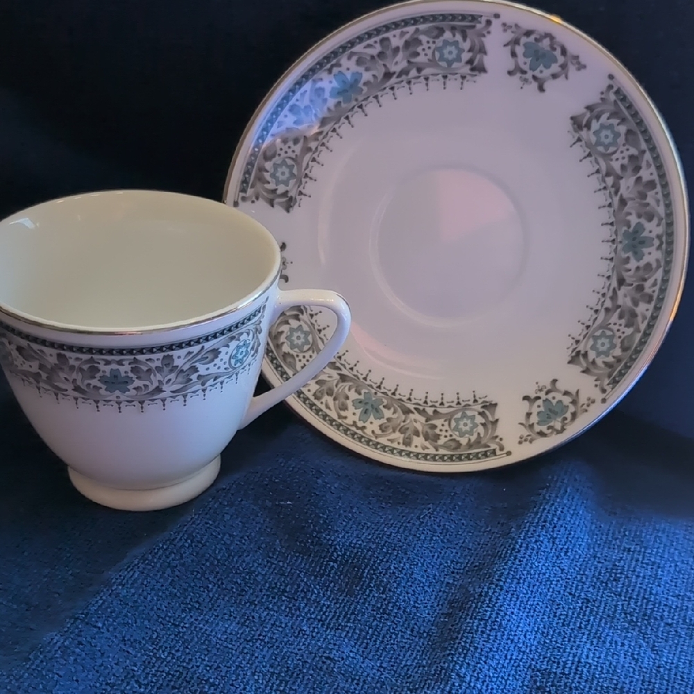Elegant White and Blue Teacup and Saucer Set